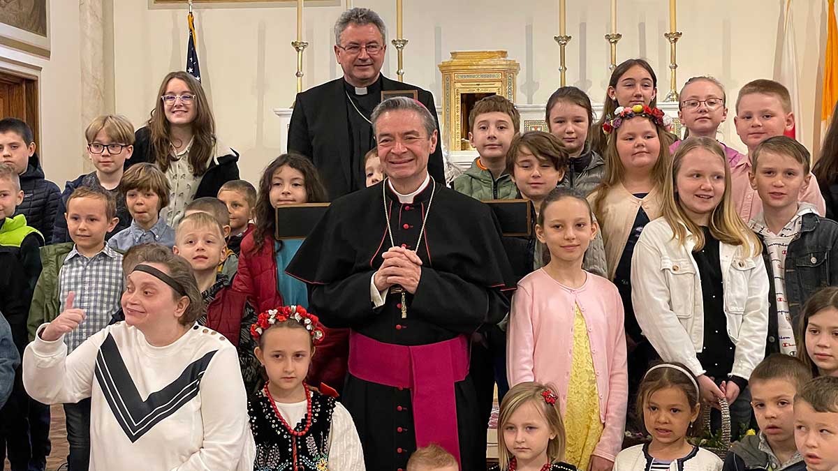 Bishop Brennan Blesses Easter Food Baskets with Polish Community. Video